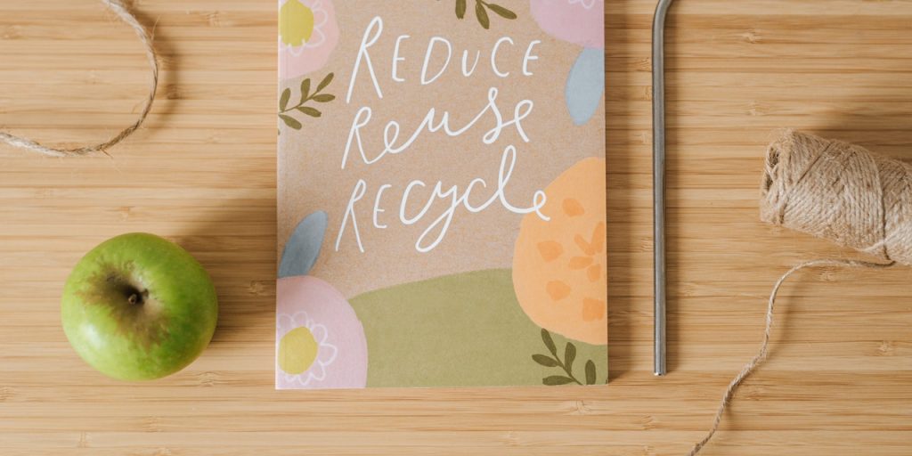 Colorful notebook with words Reduce, Reuse, Recycle on the cover
