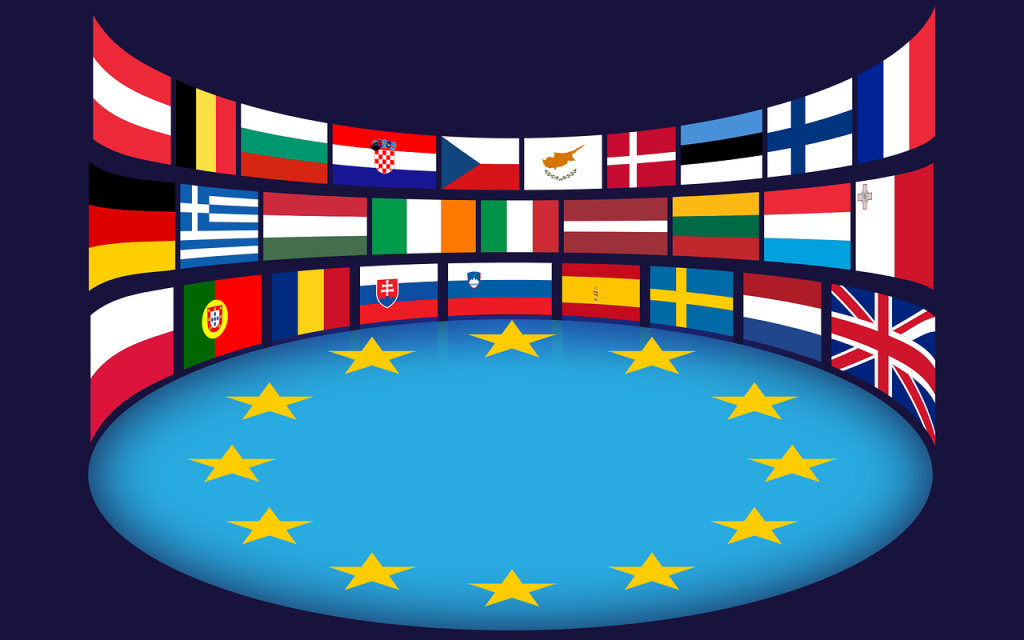 [Alt-teksti: piirroskuva, johon on sommiteltu kaikkien EU-maiden liput EU:n tähtikuvion ympärille kehykseksi.]