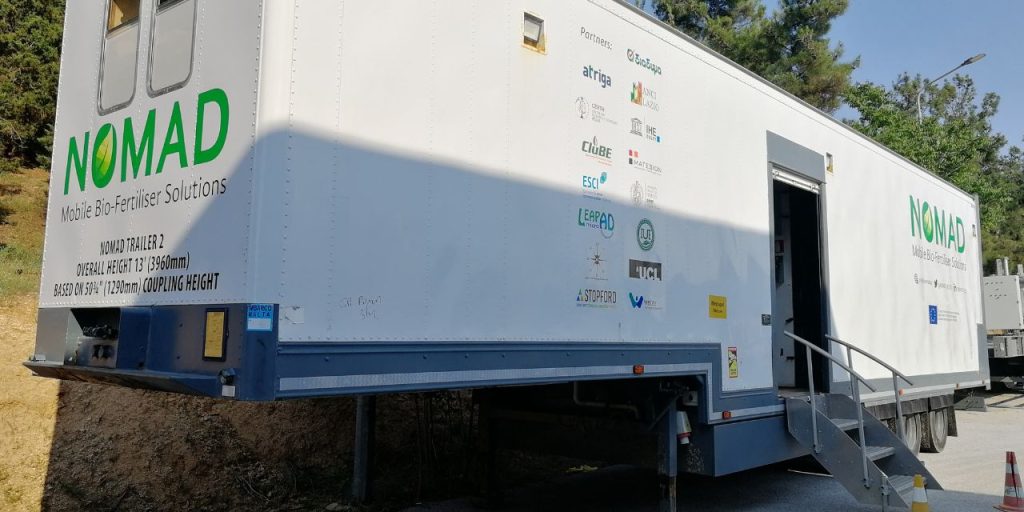  A trailer of a truck with the NOMAD projects and partners’ logos.