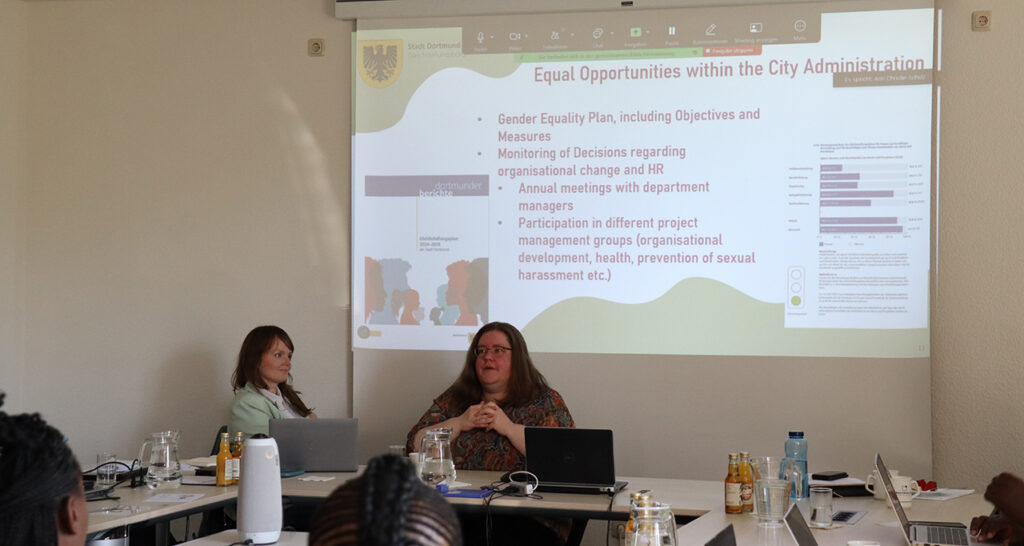 [Alt text: two persons having a presentation.]