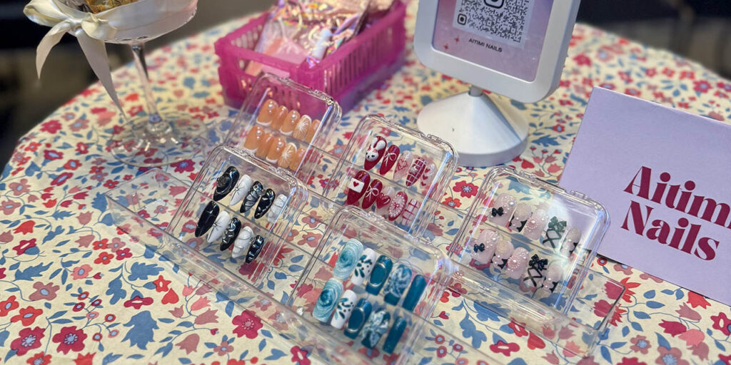 [Alt text: artificial and colourful nails in transparent small boxes.]
