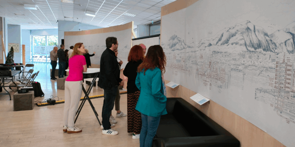 Four people inspecting a wall mural.