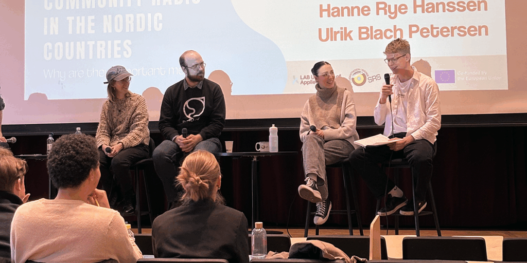 A group of people at a panel discussion at the final event of Creation of online micro-courses for student radio production project.