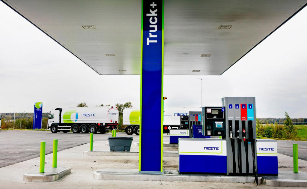 [Alt text: a tanker truck at a gasoline station.]