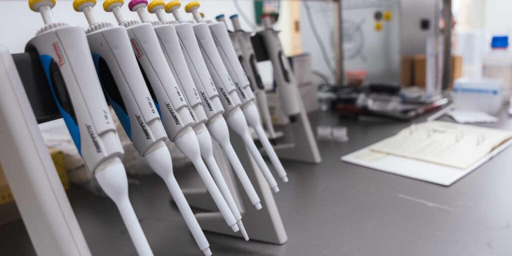 Pipettes on a laboratory bench.